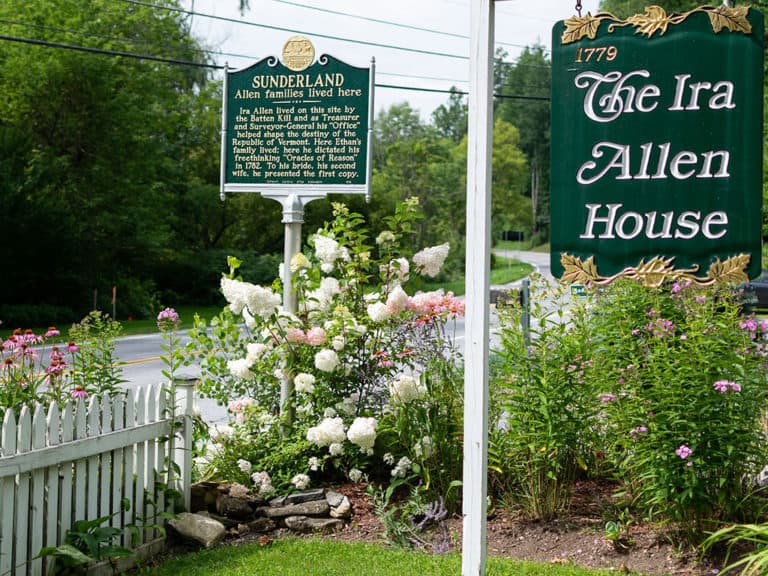 Allen Family historic marker sign and Ira Allen House sign in front garden