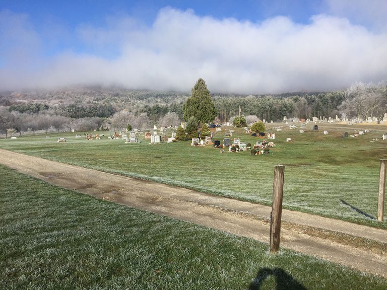 The Ira Allen cemetery in fall with frost on the grass and trees