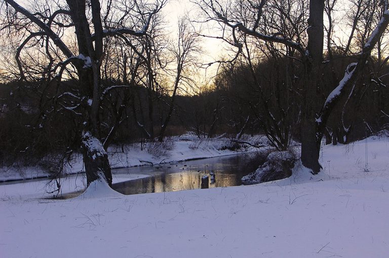 view of the front yard and Battenkill river in winter with snow